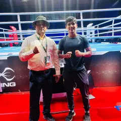 With one of my boxers at a major tournament venue. I am there with my athletes every step of the way, from the local gym to the national stage.