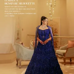 Create a signature silhouette. This client's choice of a voluminous, fully embellished blue lehenga with a dramatic cape establishes a powerful and personal style statement.