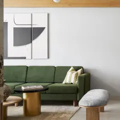 A closer look at the living area, featuring a mix of textures from the velvet sofa to the jute rug and wooden bench. I layer materials to create spaces that are visually interesting and feel warm to the touch.