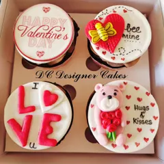 A sweet and simple gift box for Valentine's Day. This set of four cupcakes includes custom toppers with messages like "Bee Mine," "I Love U," and a cute teddy bear.