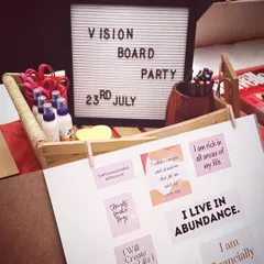 A glimpse into the creative process at a Vision Board Party. With affirmations like "I live in abundance" and "I am financially free," we focus on putting our deepest desires onto the board. This is where we get busy manifesting.