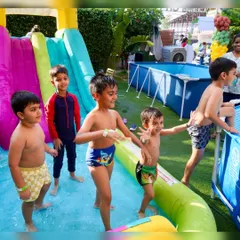 Kids having a blast at our jungle-themed pool party. It's pure joy, with plenty of space to splash, play, and make new friends.