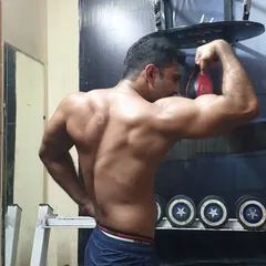 Focusing on back and bicep definition. A strong back is crucial for posture and overall strength, and we target it with a variety of pulling exercises.