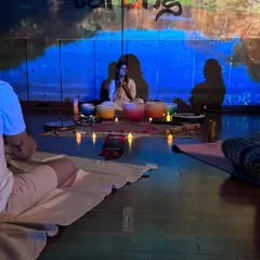 A closer look at the heart of our sound bath. Our practitioner uses a set of crystal singing bowls, each with a unique frequency, to create vibrations that help quiet the mind and restore balance. The candlelight and nature projections complete the tranquil vibe.