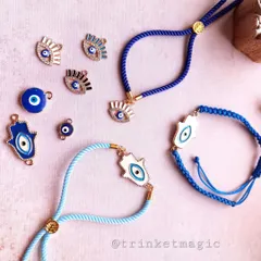 Good vibes only. My evil eye Rakhi collection is all about style and protection. This flat lay shows some of the Hamsa hand and evil eye charms you can choose from, all on adjustable bands that can be worn as bracelets all year.