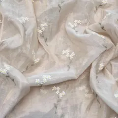 Light as a whisper, rich as a legacy. This Chanderi tissue fabric with delicate white floral embroidery is the epitome of understated elegance, perfect for a classic suit set or saree.