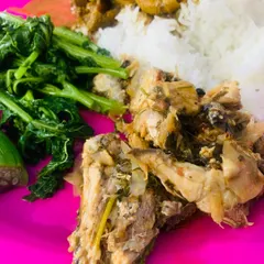 A simple thali with fish, beef innards, and boiled greens.