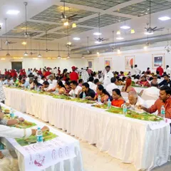A wide view of a marriage ceremony lunch in full swing. My team ensures a seamless dining experience for a large number of guests, all enjoying a traditional meal together.
