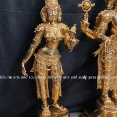 The goddess Sridevi, the consort of Vishnu representing wealth, from a Balaji set. The polished bronze finish highlights her graceful posture and intricate jewelry.