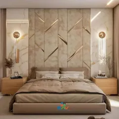 This luxurious bedroom design features a stunning accent wall with marble-finish panels and geometric gold inlays. The wall-mounted sconces add a touch of hotel-like elegance.