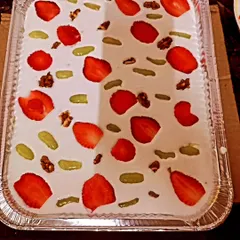 This is a modern dessert we created, a creamy pudding topped with fresh strawberries, walnuts, and a light fruit coulis. We can create custom desserts to fit your event's theme.