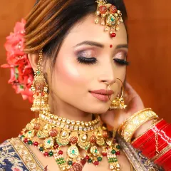 A beautiful close-up of a bride's eye makeup. The shimmery pink and gold tones are blended perfectly to create a soft, romantic look for her wedding day.
