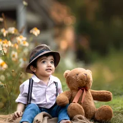 A quiet moment with a furry friend. Outdoor shoots allow for beautiful, naturally lit portraits like this one.