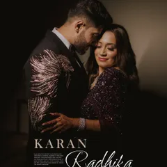 An intimate couple portrait from their engagement night. The dark background and focused light create a dramatic, cinematic feel, highlighting their connection.
