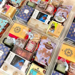 A stunning display of our custom acrylic trunk hampers, each filled with a lavish selection of premium products for a truly memorable gift.