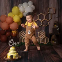 There is nothing more joyful than a first birthday cake smash! I love capturing the pure, uninhibited excitement as your little one dives into their cake. This honey bee theme is just one of the many creative setups I offer.