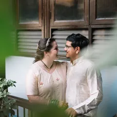 A sweet, intimate portrait of Jessie and Purujit, framed by the leaves of a plant in their home. Shooting in a place that means so much to the couple adds an extra layer of meaning to the photos.