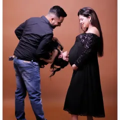 A maternity session is even more special when an older sibling is involved. This playful, candid moment captures the love and anticipation of the entire family as they wait to welcome their newest member.