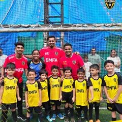 It all starts here. A group photo of our youngest grassroots players with their coaches. We welcome everyone, starting from age two, into the SMFA family, creating a fun and supportive space to fall in love with the game.