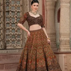 From our "Bridal Saga" campaign, this image showcases a beautiful brown lehenga with intricate embroidery, perfect for a bride who wants a unique and earthy look.