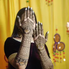 A stunning back hand design featuring lotuses and intricate patterns, perfect for a bride who wants something unique.