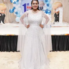 A touch of silver for a glamorous birthday celebration. This client is sparkling in a white and silver ball gown, perfect for a milestone birthday party.
