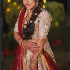 A close-up look at the beautiful details and the happy smile of our bride. The delicate embroidery on the sleeves and the traditional jewellery complete her stunning wedding day ensemble.