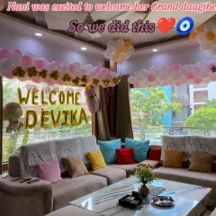 A grandmother's love is so special, and I was honored to create this welcome decor for her granddaughter, Devika. The living room is filled with pink, white, and gold balloons, creating a warm and celebratory homecoming.