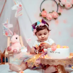 A first birthday is pure magic. This unicorn-themed cake smash is one of my most popular setups, designed to be as fun and whimsical as your little one. We let them get messy and capture their genuine delight.