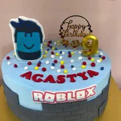 Level up your birthday with a Roblox-themed cake. This design features the iconic blocky aesthetic and a character topper, perfect for any young gamer celebrating their special day.