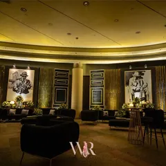 We transformed this ballroom into a sophisticated Jazz Club for a cocktail night. The design featured lounge areas with black velvet seating, large-scale portraits of jazz legends, and warm, ambient lighting to create a cool, speakeasy vibe.