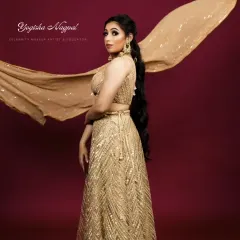 Another shot from the designer campaign, with the flowing dupatta adding movement and drama. The makeup remains flawless, enhancing the model's elegance.