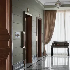 First impressions begin the moment the lift doors open. For this expansive office lobby, I aimed for a cinematic feel, using a calm sage green and custom black-and-white marble flooring to create a grand, yet welcoming, prelude to the creative world inside. This is where timeless elegance meets contemporary sophistication.