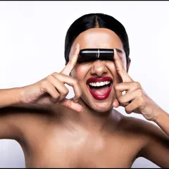 Fun and playful shots are key to making a brand feel relatable. Here, the model interacts with the lipstick in an unexpected way, breaking the fourth wall and creating an engaging, energetic image perfect for social media and online advertising.
