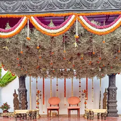 A bride's dream of a temple-style mandap, brought to life with stone-washed textures and a canopy of delicate, hanging florals. This sacred space was designed to feel as if it held generations of blessings.