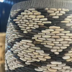 Another close-up showing the meticulous craftsmanship of the black and white pebble design.