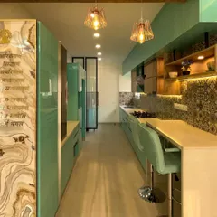 For this modular kitchen, we used our in-house factory to produce vibrant, high-gloss PU-finished cabinets. The execution included installing the patterned tile backsplash, quartz countertops, and integrated breakfast bar, all while ensuring perfect alignment and functionality with Hettich hardware.