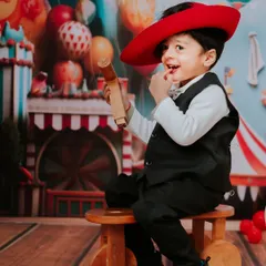 Our tiny ringmaster stealing the show for his second birthday. The carnival theme was full of color and fun, a perfect match for his energetic and playful spirit.