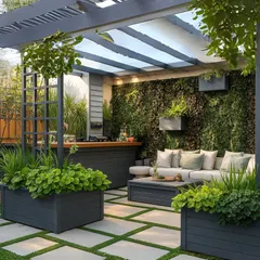 This luxurious patio design features a comfortable seating area and an outdoor kitchen under a louvered pergola. The floor combines large pavers and grass, and oversized planters with lush greenery define the space.