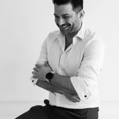 A candid black and white portrait of me, Shahen Mistry. I believe that great design comes from a place of passion and a genuine love for creating beautiful, functional spaces.