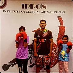 A good instructor teaches students how to fight, but I believe a great one teaches them how to survive. Here I am with two of my young students at the Ippon Institute in HSR Layout.