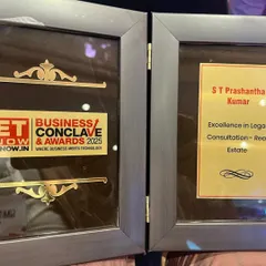 A close-up of the plaque awarded to Senior Partner S.T. Prashantha Kumar at the ET Business Conclave & Awards 2025. The award acknowledges his outstanding contributions to real estate legal consultation.