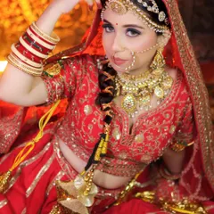 The sheesh patti is a fantastic way to frame the face and add a royal touch. This bride is wearing a multi-layered version with a central tikka, creating a very grand and traditional look.
