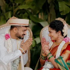 A quiet moment of connection between the bride and groom during their wedding ceremony. The shared glance and gentle smiles speak volumes about their bond.