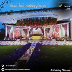 This is where elegance meets celebration. We designed this grand reception stage with a stunning overhead floral chandelier and a mirrored walkway lined with lush purple flowers, creating a luxurious and unforgettable ambiance for the couple and their guests.