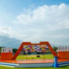 A daytime view of the presentation stage we constructed for the TNPL. Our design ensures that league and sponsor branding is prominent, providing a clean and professional look for both live audiences and broadcast.