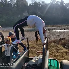You can practice yoga anywhere, even on a jungle safari. Here I am doing a wheel pose on the back of a jeep while my kids watch on, making fitness an adventure.