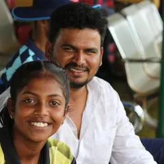 A player enjoying a moment with a family member or supporter on the sidelines.