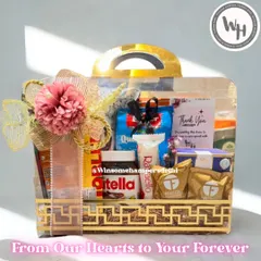 This wedding hamper, presented in a stunning golden acrylic case, is filled with premium chocolates and treats. It's a beautiful way to send blessings and congratulations to the happy couple.