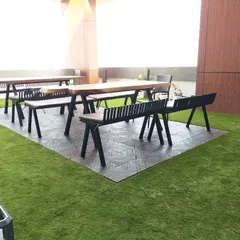 This recently completed project showcases our artificial lawn turf used to create a clean and comfortable seating area on a building's terrace. The turf provides a durable, evergreen surface perfect for outdoor furniture and recreational use.